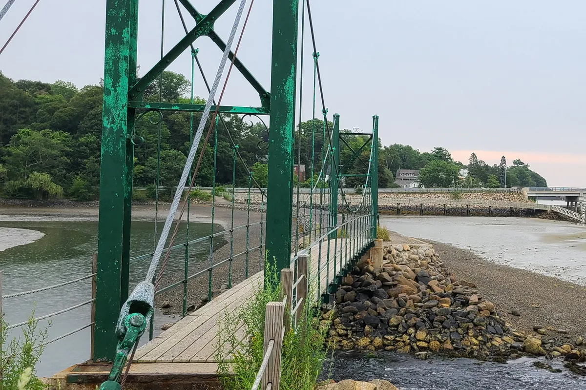 The Wiggly Bridge, a small green suspension footbridge in York, Maine